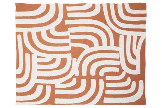 Patterned fabric with wavy lines on a brown background
