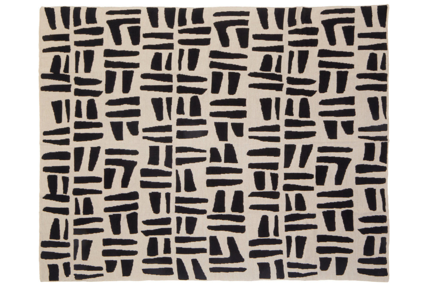 Beige throw with black abstract pattern