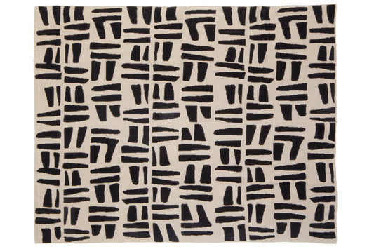Beige throw with black abstract pattern