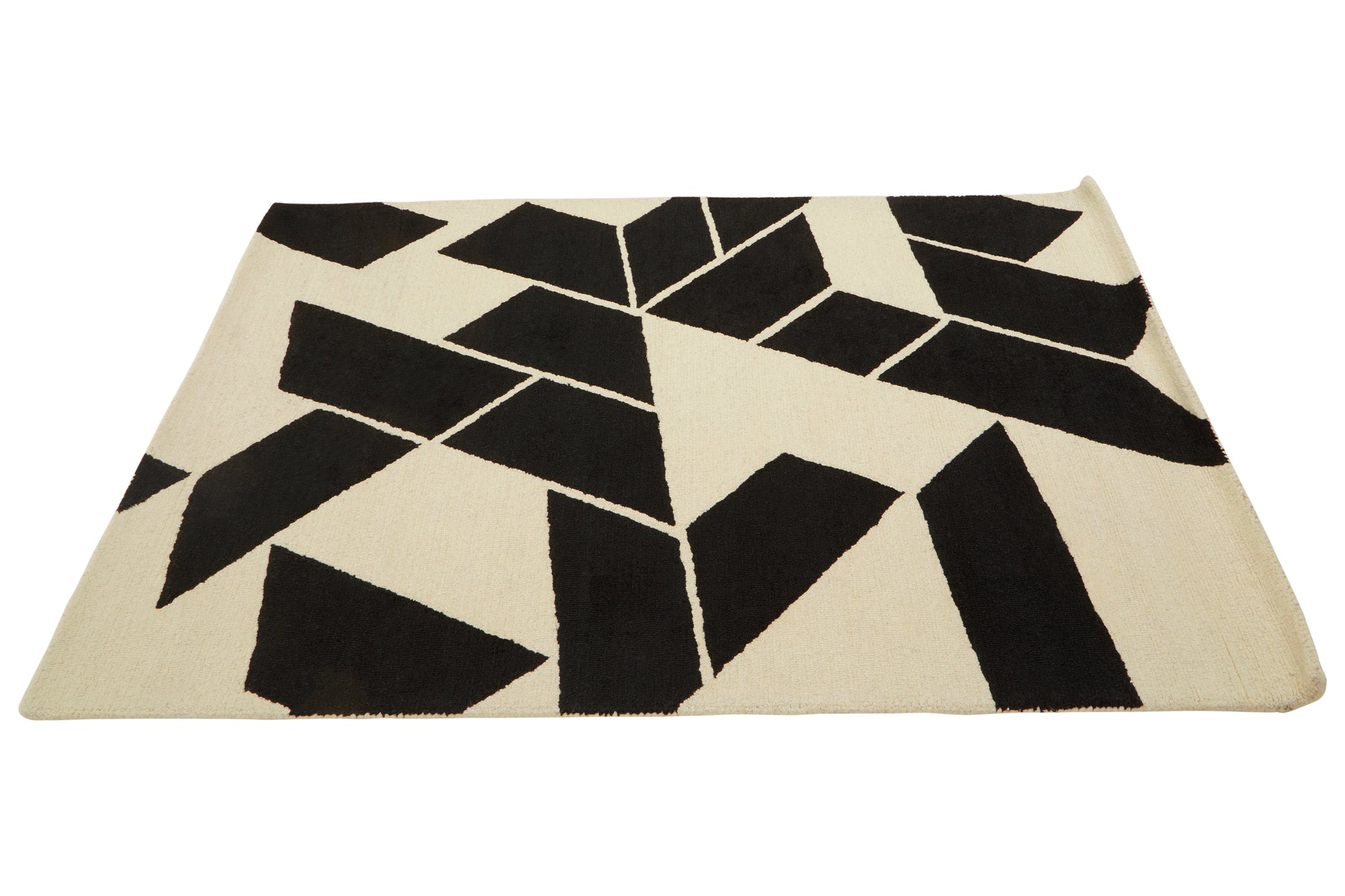 Beige rug with black geometric pattern on a white background