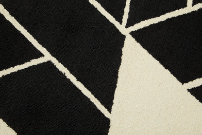 Close-up of a black and white geometric patterned rug