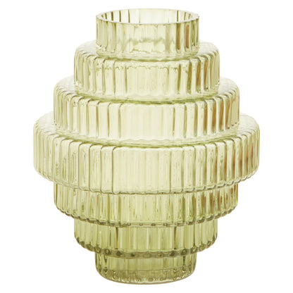 Decorative glass vase with ribbed texture on a white background