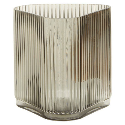 Glass vase with ribbed design on a white background