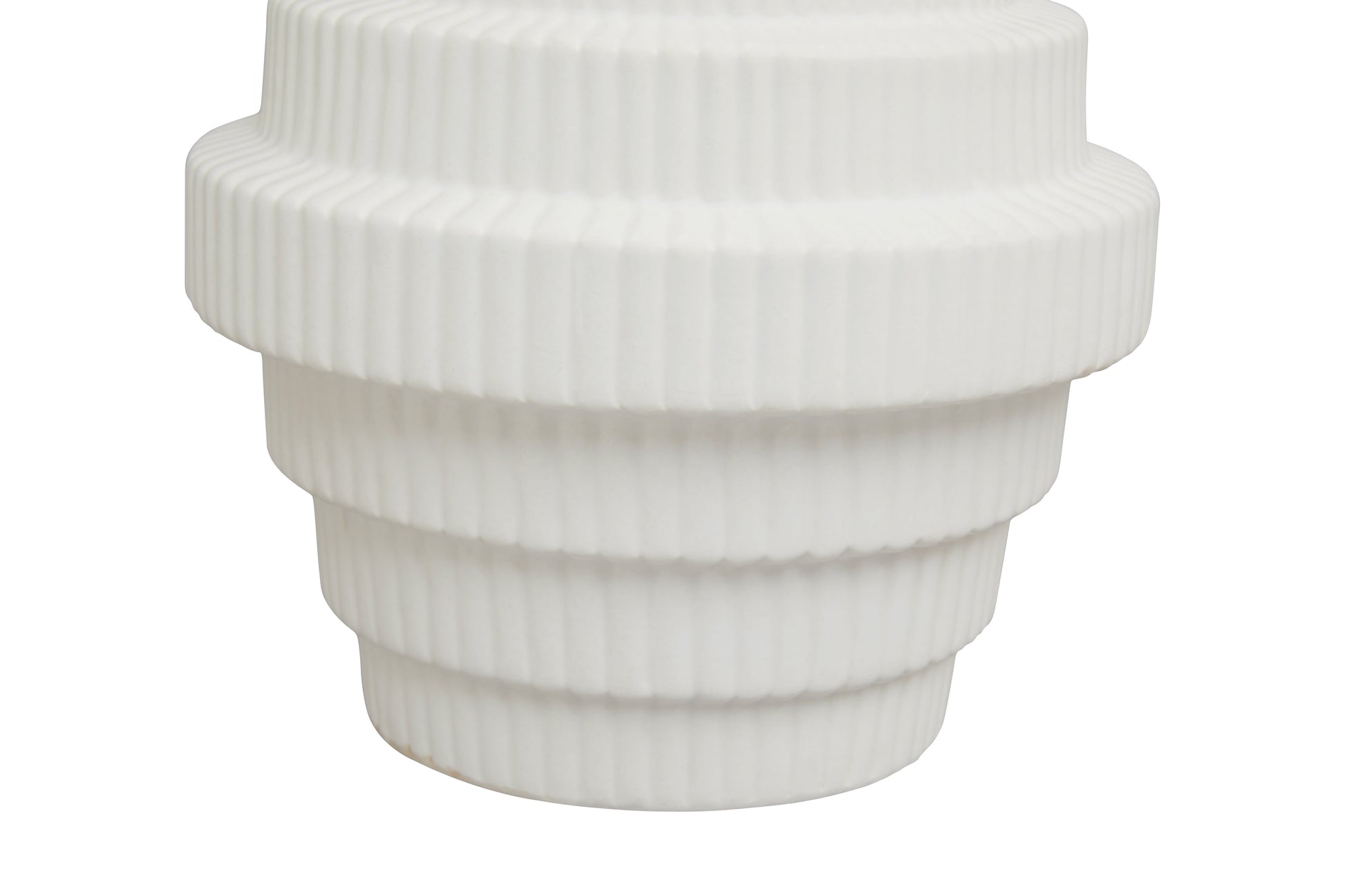 White ribbed vase on a white background