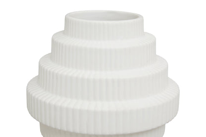 White ribbed vase on a white background