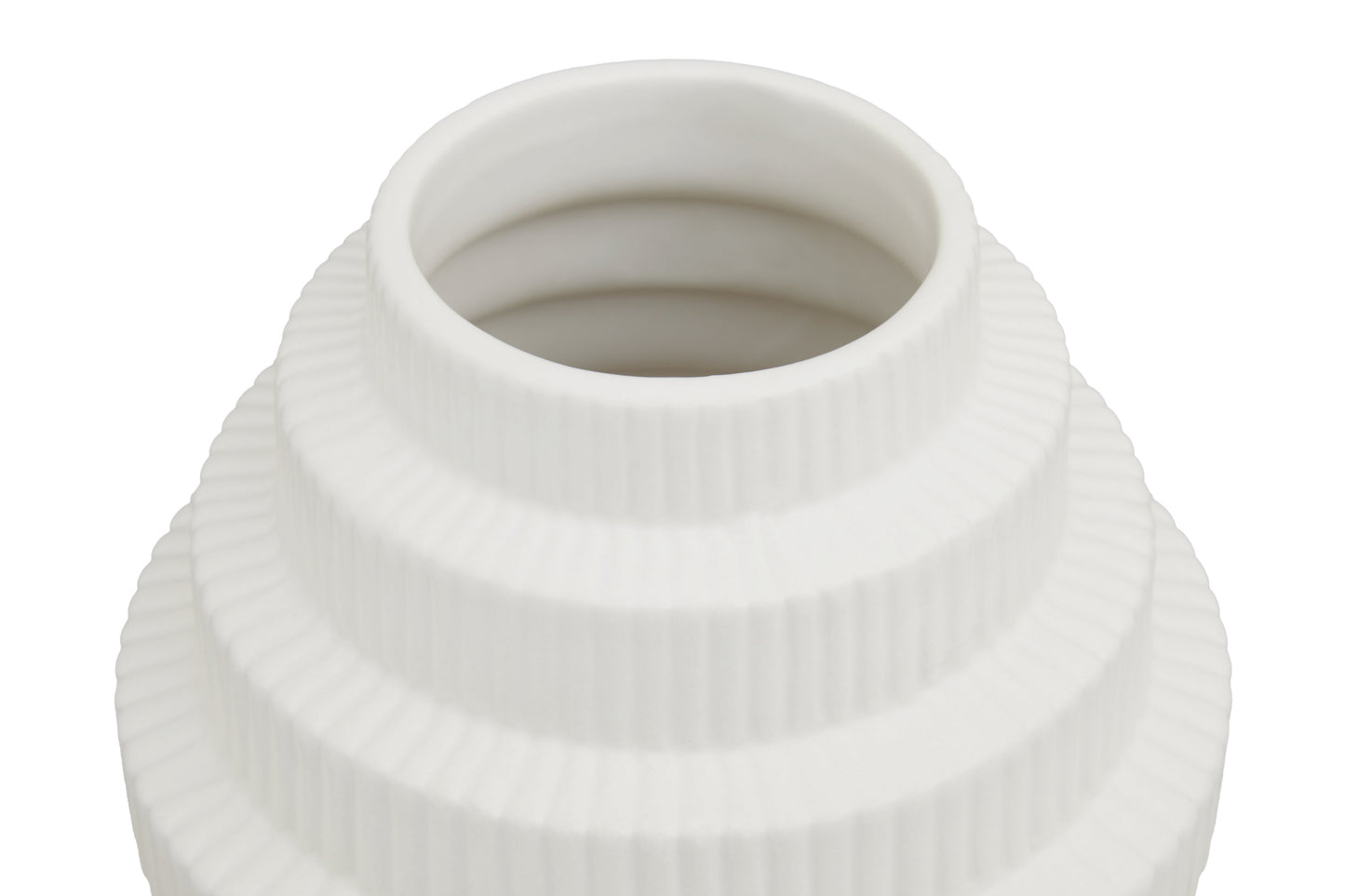 White ceramic vase with textured surface on a white background