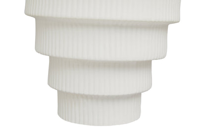 White ribbed vase on a white background