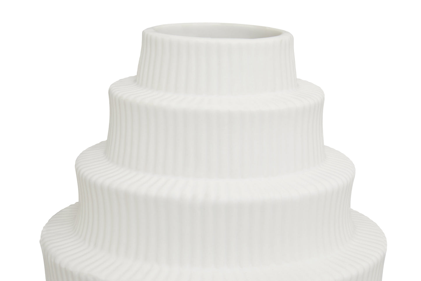 White ceramic vase with ribbed texture on a white background