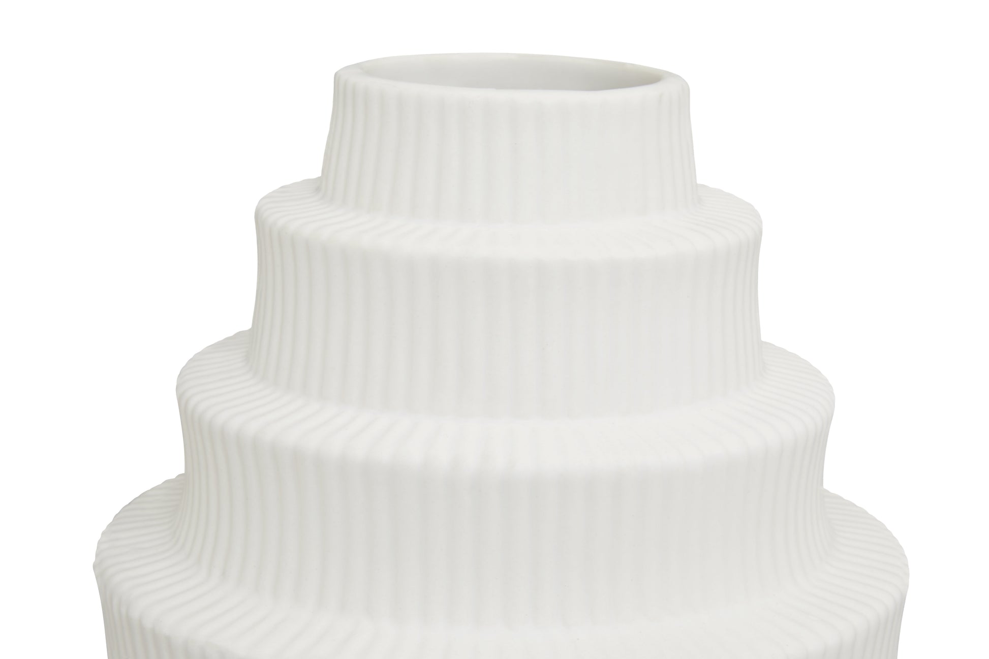 White ceramic vase with ribbed texture on a white background