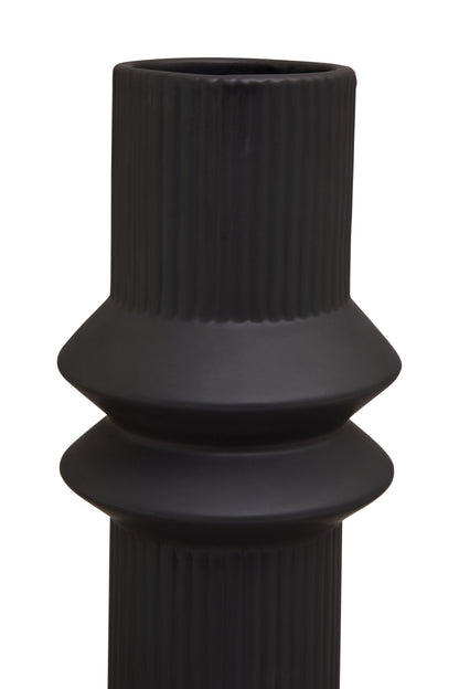 Black textured vase on a white background