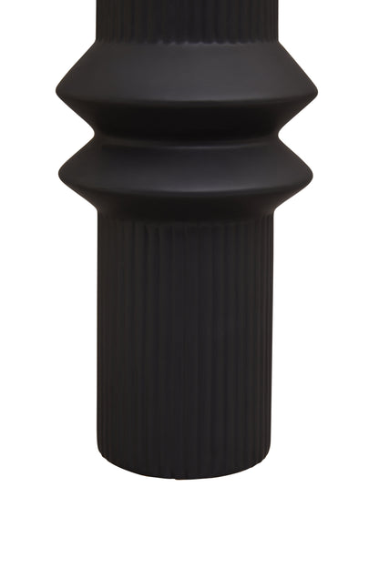 Black textured vase on a white background