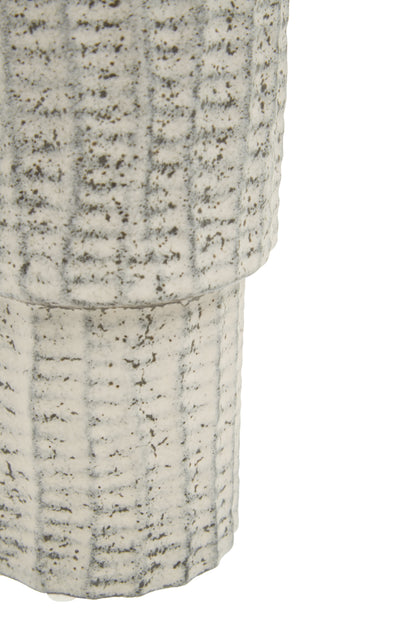 Close-up of a textured cylindrical object on a white background