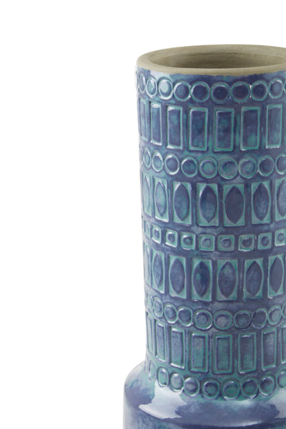 Ceramic vase with blue and green pattern on a white background