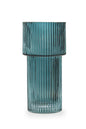 Blue ribbed glass vase on a white background