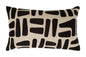 Decorative pillow with black abstract pattern on beige background