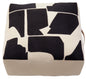 Square ottoman with black abstract pattern on a white background
