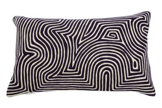 Decorative pillow with black and white wavy pattern on a white background