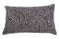 Decorative pillow with black and white wavy pattern on a white background