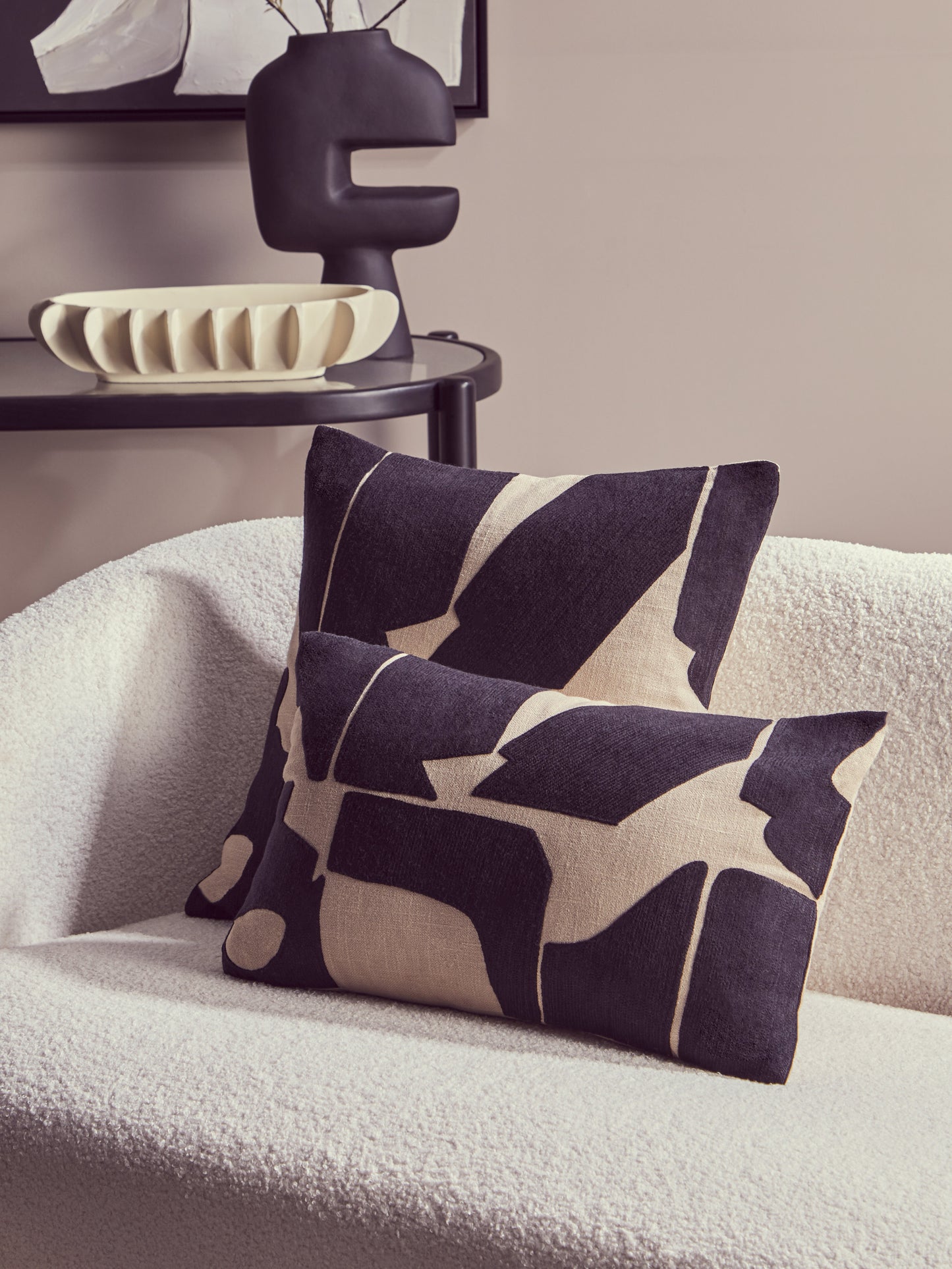 Decorative abstract pillows on a light-colored sofa