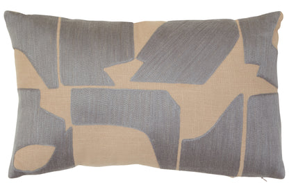 Decorative pillow with geometric pattern in gray and beige on a plain background